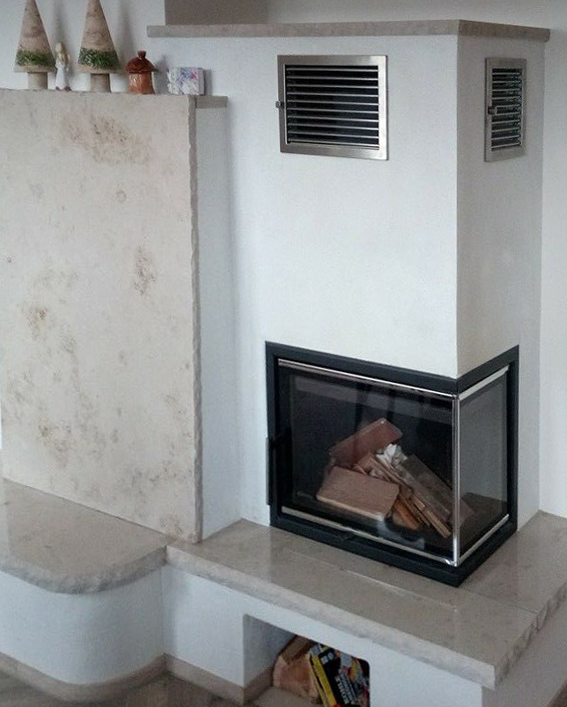 Kamin mit Natursteinsitzbank sehr stilvoll aber kantig